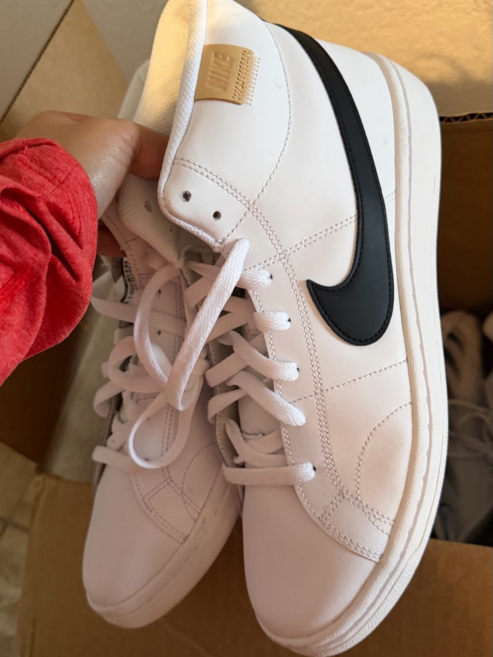 Nike Women’s White Leather Sneakers with Black Swoosh Accent